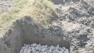 Stone filling in column footing bottom for boundary wall
