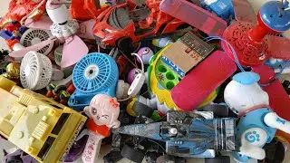 Discovering many mini fans & old toys | Found two mini ceiling fans inside.