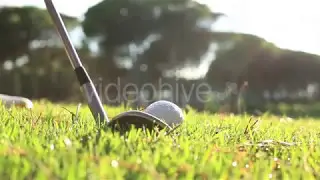 Golf swing on green grass