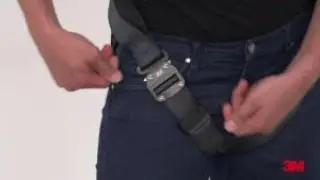 Donning a vest style harness