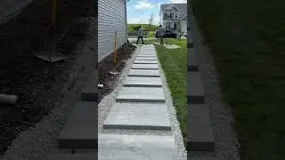 Beautiful pathway with paver slabs and decorative stone. #pavers #outdoorliving #patio