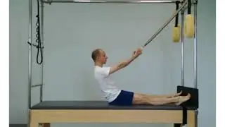 Assisted roll down. Flat back assisted. Trapeze-table.