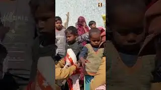 Volunteers Helping the Needy by Distributing Clothes