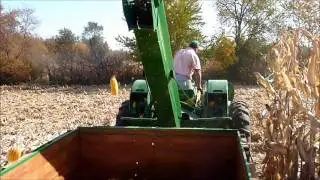 John Deere 530 picking corn while pulling original John Deere Wagon