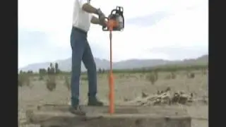 Lewis Multi Drill drills through thick wood using long ship auger drill bit and chainsaw.