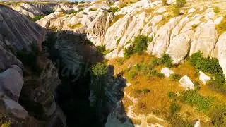 Dolly zoom. Goreme, Nevsehir, Turkey. Serene canyon landscape near Goreme, featuring dense greene...