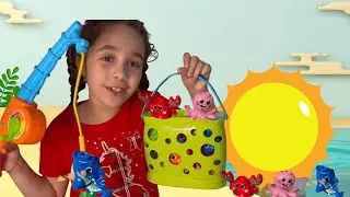 Karolyn plays with a VTech Fishing Toy
