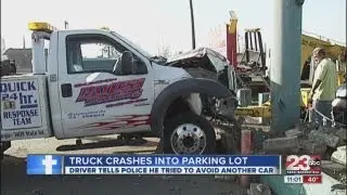 Tow truck crashed into parking lot