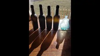 Digging a nice pontil pit with scroll flask and whiskey cylinders.