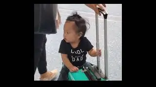Baby Keon enjoying the Younglingz Lil Flyer suitcase child stroller spinner luggage