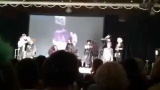 Robert Cromeans cuts Hannah VanHam's hair on stage at the Icons Hair Show