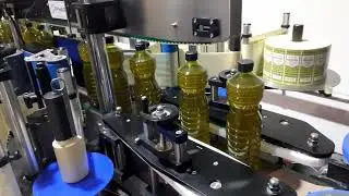 Etiquetadora de botes de aceite doble cara y envolvente | Grupo PYMAR