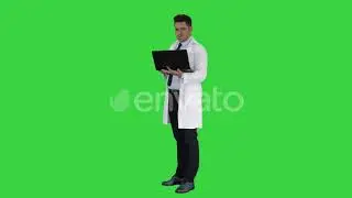 Doctor showing results in laptop on a Green Screen, Chroma Key | Stock Footage - Videohive