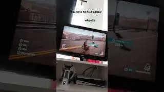 how to do a wheelie in riders republic