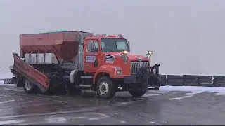 Snow plows work to clear roads and sidewalks, despite shortages