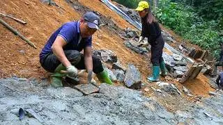 The young couple worked together to reinforce roads after the natural disaster to earn extra income.