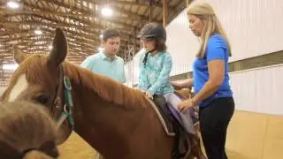 PGA golfers help kids ride horses