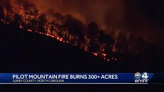 Firefighters battle wildfire on Pilot Mountain