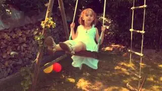 Little girl on a swing, my girl