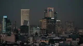 Madrid city scene with skyscrapers and highrise buildings at night, Spain