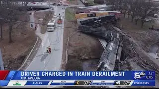 Semi-truck driver charged in train derailment