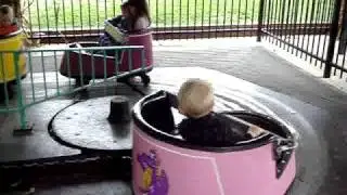 Jax riding a pink spinning thing