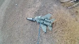 Drone recovery. Large quad recovers downed RC airplane