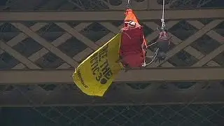 Greenpeace activist stages Eiffel Tower protest calling for release of 'Arctic 30'