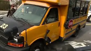 Crash leaves school bus on its side in Lowell, Massachusetts