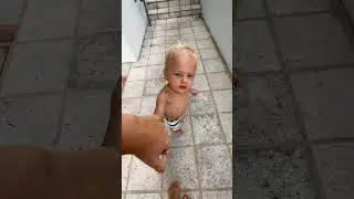 Baby David is playing with Naomi in the refreshing pool