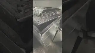 Spraying Hardcast 5 gallon Black Coil Tack adhesive on Fiberglass Duct Liner as Edge Coating