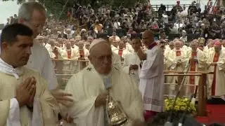 Pope Francis falls during service
