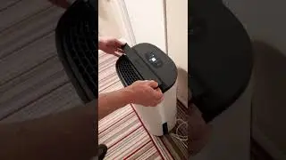Using the handle on a meaco dry 25l arete one dehumidifier / air purifier