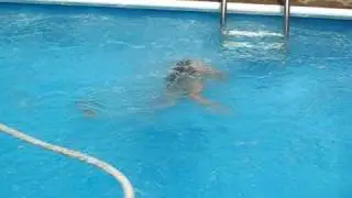 Sara Lyon jumps in the pool