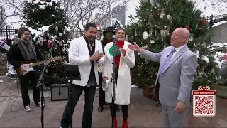 Soul Circus performs in the water garden for Jude's Jingle Tree