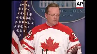 White House Press Secretary Robert Gibbs donned a Canadian hockey jersey at the daily briefing on Fr