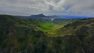 Drone aerial of lush green volcanic valley on Oahu, Hawaii