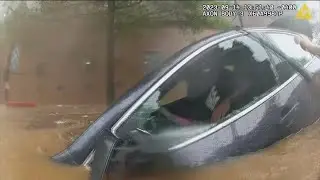 Dramatic video shows Atlanta Police officer rescue trapped driver inside flooded car