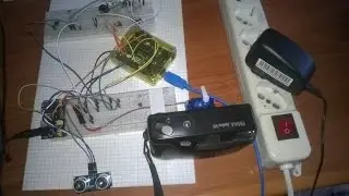 AUTOMATIC SERVO CONTROL SYSTEM OF CAMERA EXPOSURE WITH  ULTRASONIC AND LIGHT SENSORS