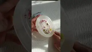 Pressed flowers floating in resin soap tray