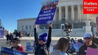 JUST IN: Protesters Gather Outside Of Supreme Court Building As Court Hears Cases On Trans Athletes