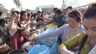 Almsgiving ceremony at King Fa Ngum Park