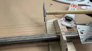 A piano that sparks when it hits the strings, test 1 (fly killer on guitar)