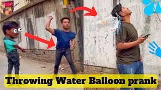 Holi special Prank | Throwing water balloon prank with twist | Hilarious Water Balloon Prank on Holi