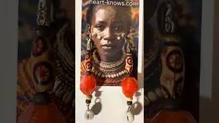 Every eye on you mosaic wood African cowrie Shell shoulder earrings.