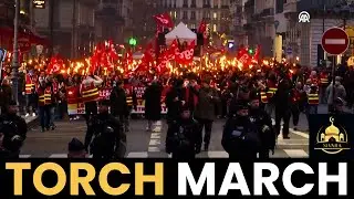 Paris workers march with torches as unions challenge new finance bill