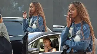 Malia Obama smokes cigarette while sporting chic fall-friendly outfit