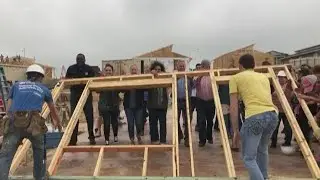 Volunteers building one home at a time