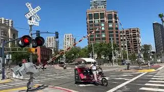Railroad Crossing Gates Raise to Let Biker Escape from Train - Market Street, San Diego, CA