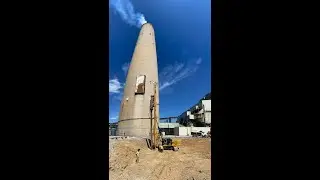 CZM EK125HH Hydraulic Hammer Piling Rig driving sheet pile at a power plant